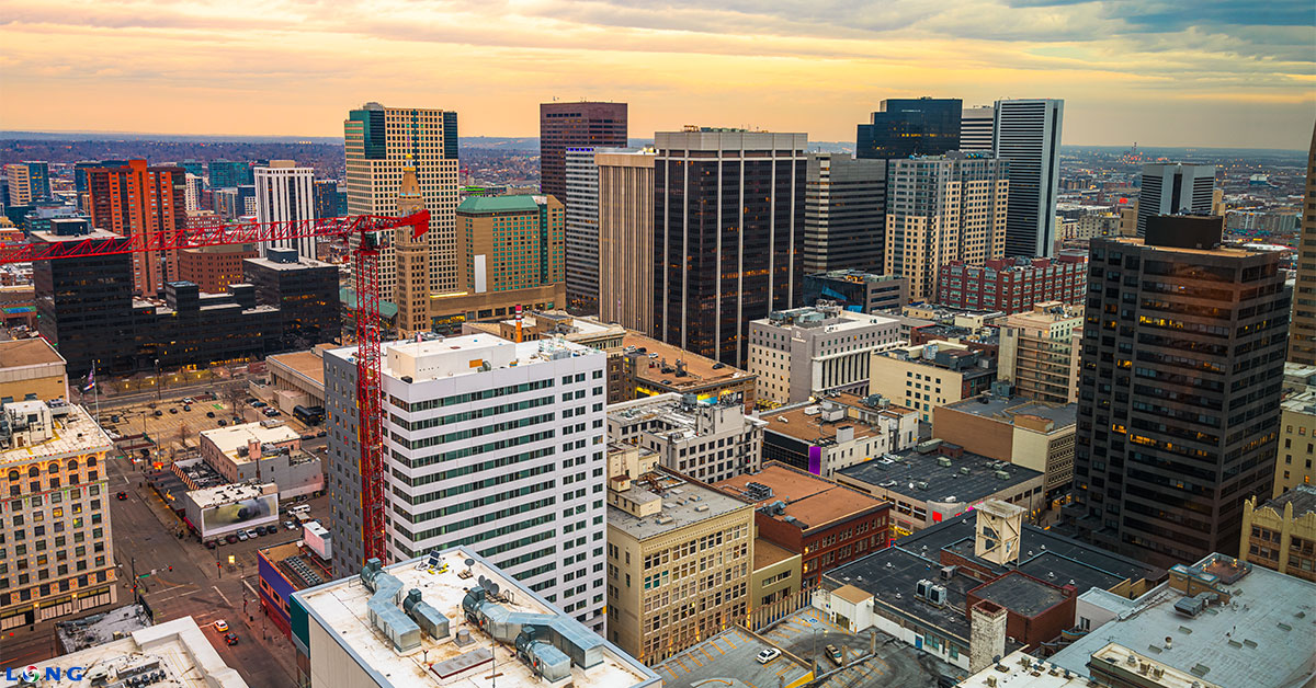 Cityscape of Denver with a giant construction crane